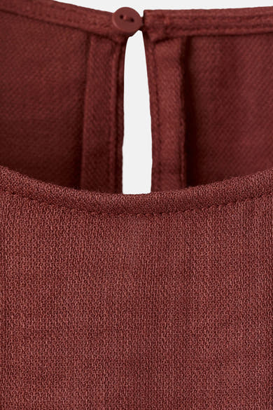 Bruin blouse met korte mouwen van MANGO, met een knoopsluiting aan de achterkant.