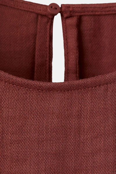 Bruin blouse met korte mouwen van MANGO, met een knoopsluiting aan de achterkant.