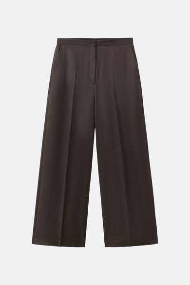Bruine broek van MANGO, losse pasvorm en wijde pijpen met gestructureerde plooien.