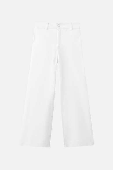 Wijde spijkerbroek van wit denim van MANGO, wijde pijpen en rechte pasvorm.