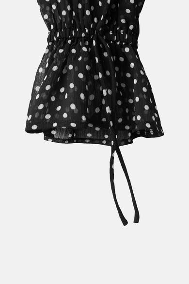 Chemisier noir à manches longues de MANGO, motif à pois blancs avec liens à nouer.