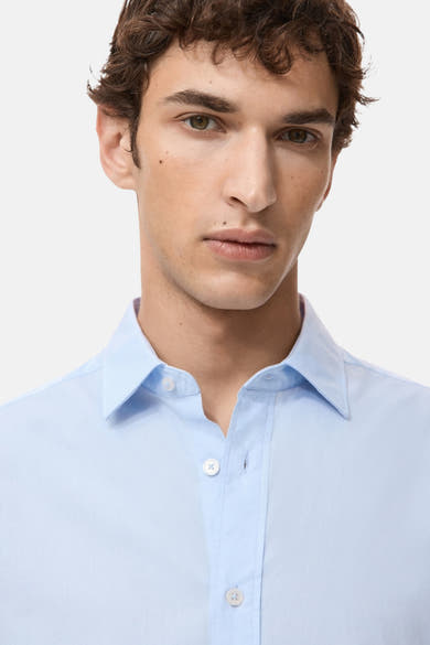 Blauwe blouse met lange mouwen van MANGO, van katoen, met een knoopsluiting.