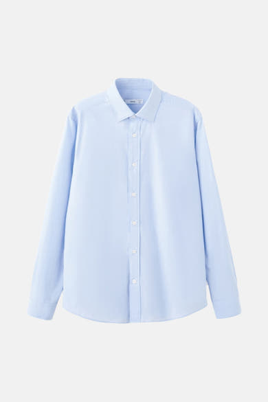 Lichtblauwe blouse met lange mouwen van MANGO, met een subtiele textuur en een klassieke pasvorm.