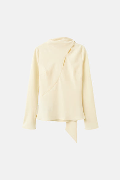 Gele blouse met lange mouwen van MANGO, met asymmetrische halslijn en strikdetail aan de zijkant.