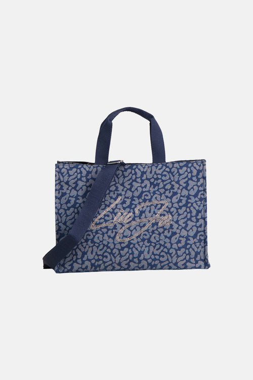 Blauwe handtas van LIU JO, met een grijs luipaardpatroon en een dubbele handgreep.