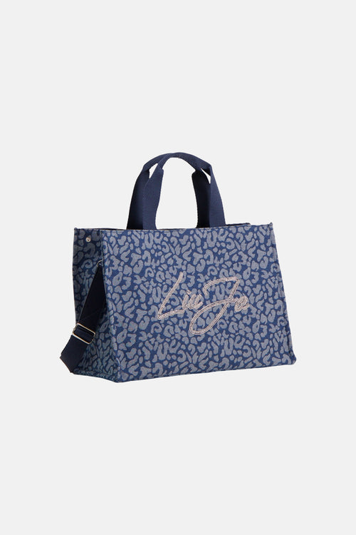 Blauwe handtas van LIU JO, met dierenprint en strass-logo aan de voorkant.