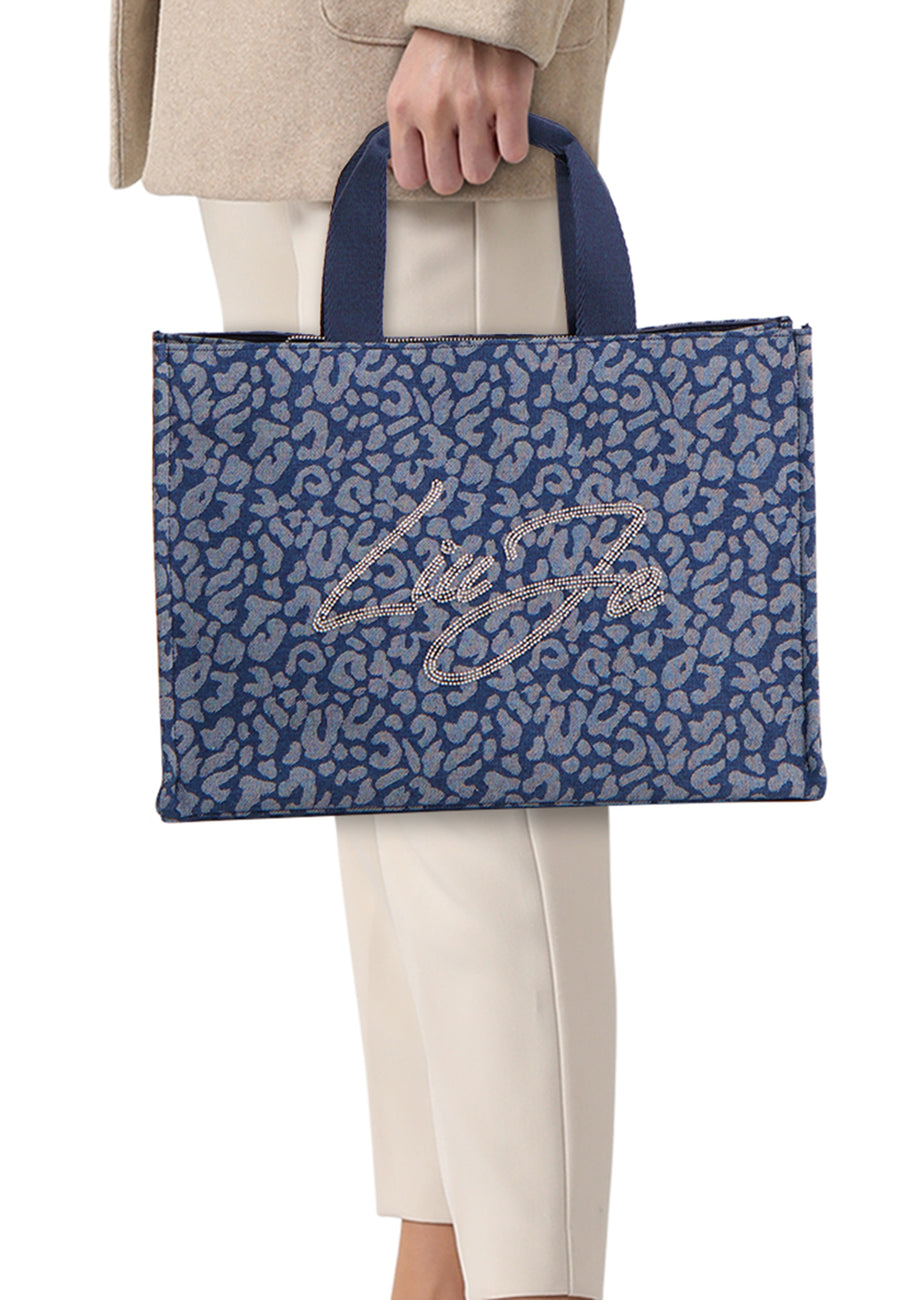 Blauwe handtas van LIU JO, met blauw en grijs dierenprint en strass-versierd logo.