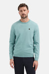 Ronde hals trui blauw van NO EXCESS, met een zeshoekige patch op de borst.