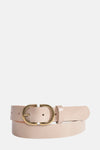 Ceinture en cuir écru de Legend, avec une boucle dorée ovale et des perforations.