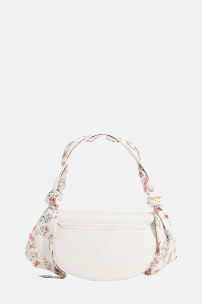 Sac à bandoulière blanc de TAMARIS avec une bandoulière à motif floral nouée.