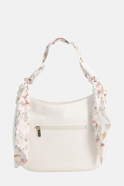Sac à bandoulière blanc de Tamaris avec motif floral sur la bandoulière nouée
