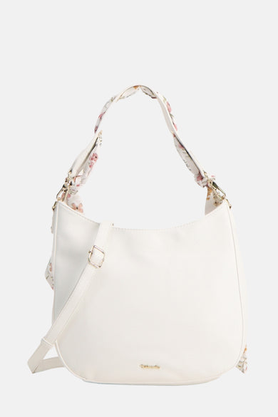 Sac à bandoulière blanc de TAMARIS avec motif floral sur la anse et bandoulière réglable.
