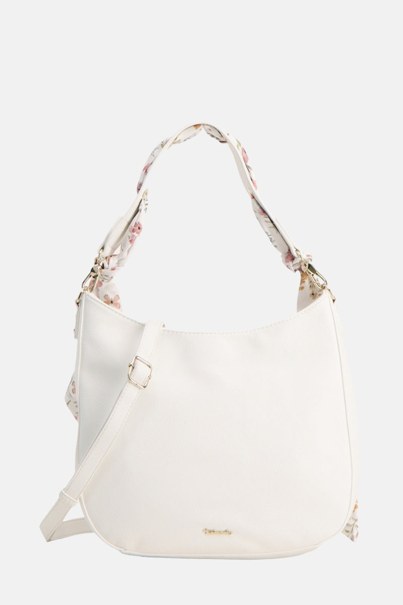 Sac à bandoulière blanc de TAMARIS avec motif floral sur la anse et bandoulière réglable.

