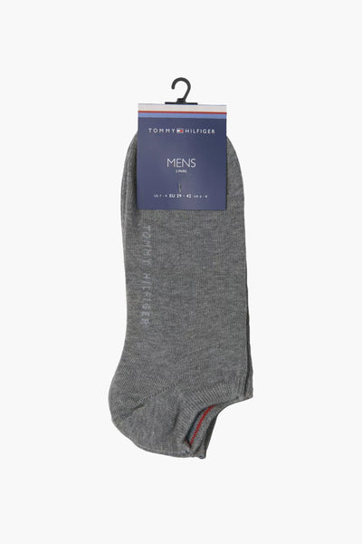 Chaussettes grises de TOMMY JEANS, présentées sur un cintre, avec un emballage indiquant la taille.
