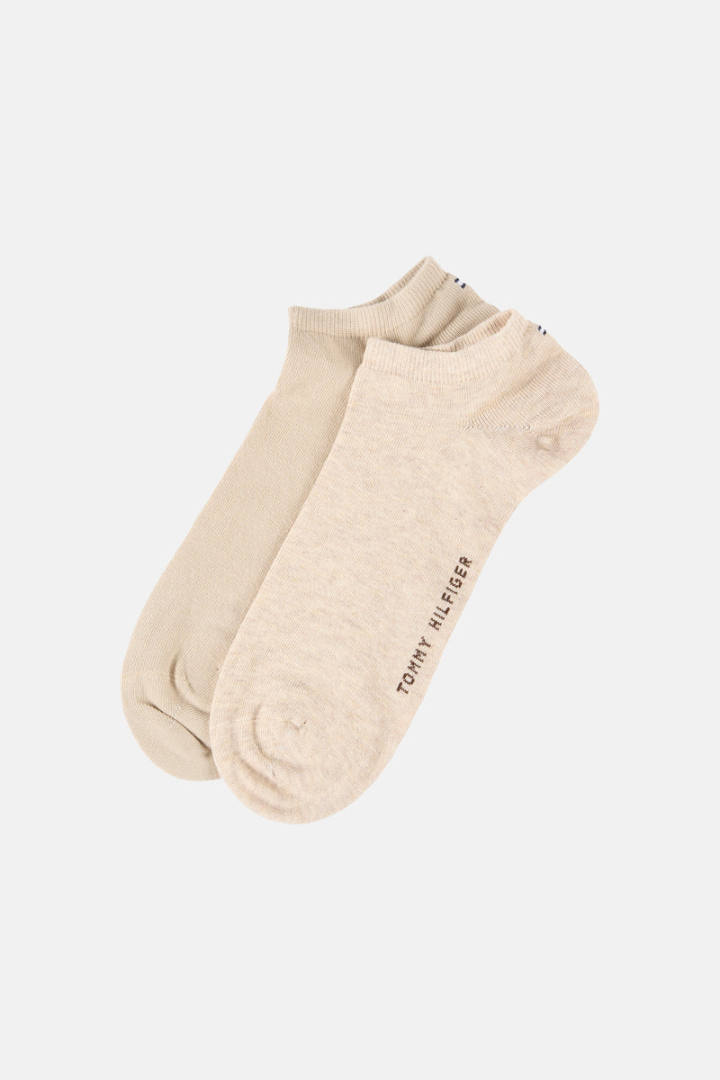 Chaussettes beiges by TOMMY JEANS, avec logo de la marque sur le côté de la chaussette droite.