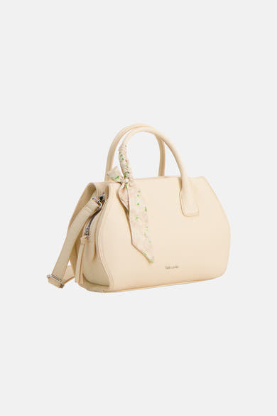 Sac à main jaune de TAMARIS, avec une écharpe fleurie nouée à la anse et une bandoulière ajustable.