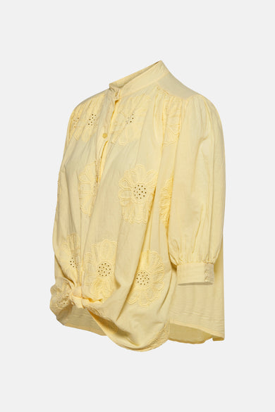 Gele blouse met lange mouwen van Terra di Siena, met bloemenborduursel en een strik aan de voorkant.