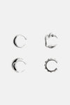 Silver-toned hoop earrings with textured and smooth finishes, featuring crescent and scalloped designs, displayed in top-down view.