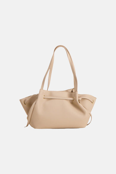 Beige textured leather shoulder bag with gold-tone hardware and adjustable strap, front view