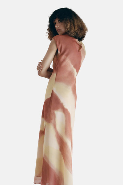 Multicolored tie-dye sleeveless robe by MANGO, flowing silhouette, back view, soft peach and cream hues, lightweight fabric