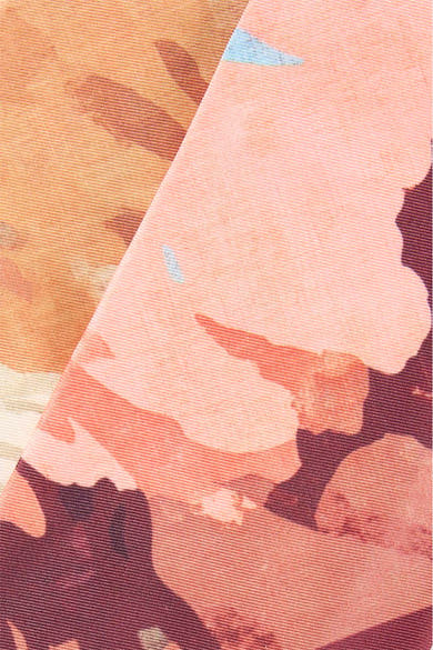 Multicolored foulard with floral pattern in peach, burgundy, and blue, close-up texture view