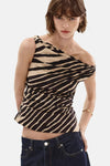 Multicolored sleeveless blouse with black and beige zebra stripes, asymmetrical wrap design, worn with dark denim jeans, front view