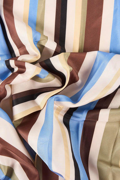 Multicolored striped foulard with blue, brown, beige, and black vertical bands, soft satin texture, close-up view