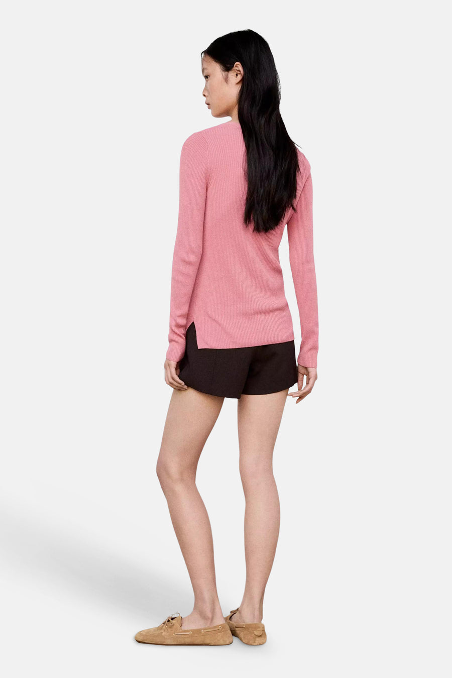 Rose ribbed knit cardigan, side view, worn with dark shorts and tan loafers, long sleeves, relaxed fit