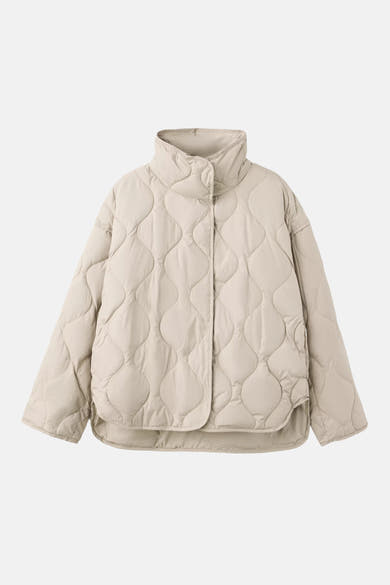 Beige quilted padded jacket with high collar and wavy stitching, front view
