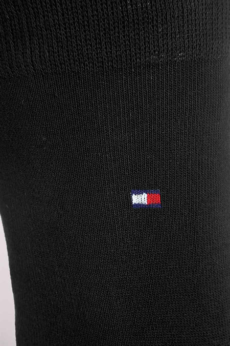 Chaussette noire de TOMMY JEANS avec logo rectangulaire bleu, blanc et rouge brodé.