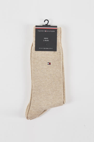 Chaussettes beiges par TOMMY JEANS, présentées emballées, avec le logo subtilement brodé.