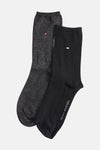 Chaussettes noires et brillantes de Tommy Jeans, avec logo discret et finitions scintillantes.
