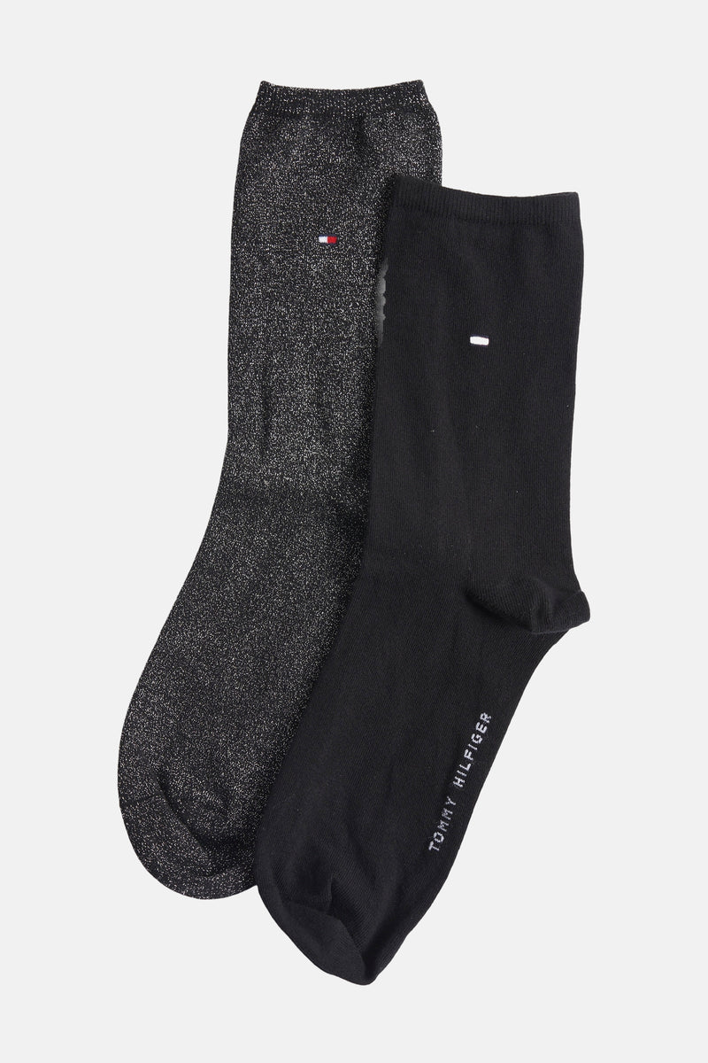 Chaussettes noires et brillantes de Tommy Jeans, avec logo discret et finitions scintillantes.