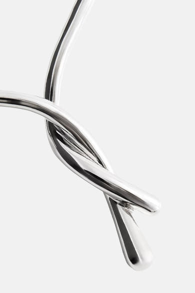 Silver twisted rope-style short necklace with polished metallic finish, close-up side view