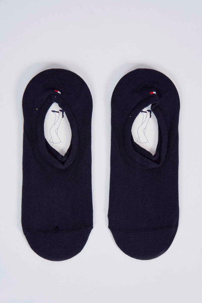 Chaussettes bleues de TOMMY JEANS avec le logo de la marque et une étiquette en carton à l'intérieur.