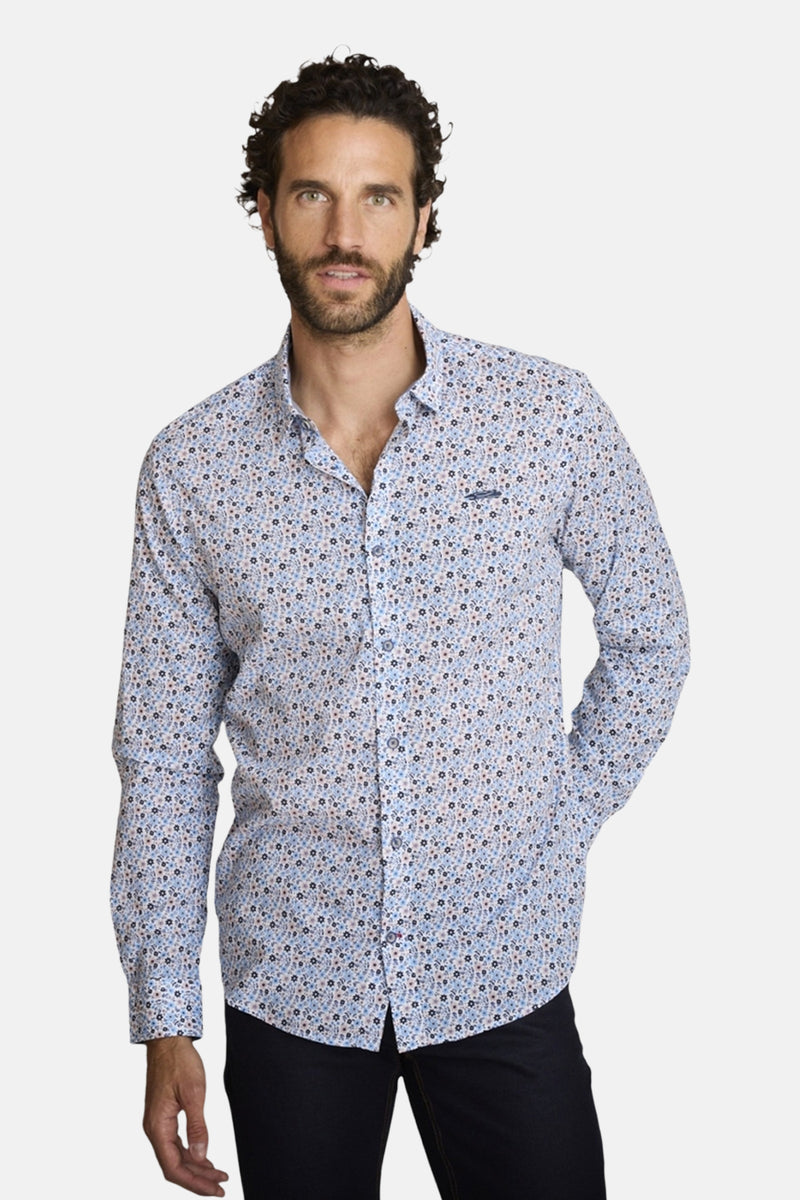 Chemise à manches longues multicolore de DELAHAYE, avec un motif floral et portée avec un pantalon sombre.