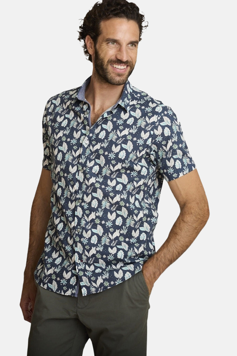 Blauwe blouse met korte mouwen van DELAHAYE, met bloemenprint en een geknoopte kraag, achterzijde.