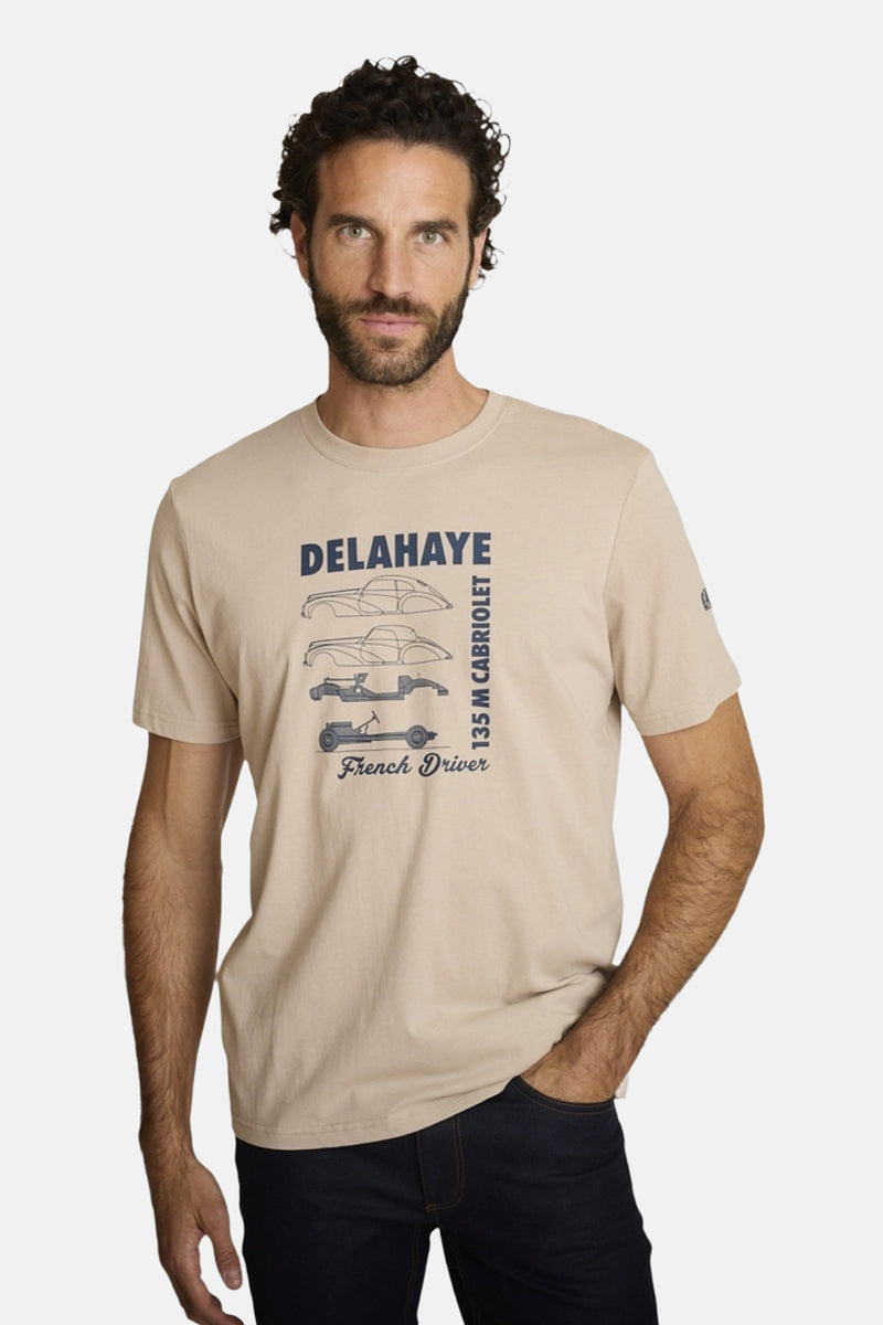 Beige polo shirt with vintage car graphic and text, front view on model wearing dark jeans