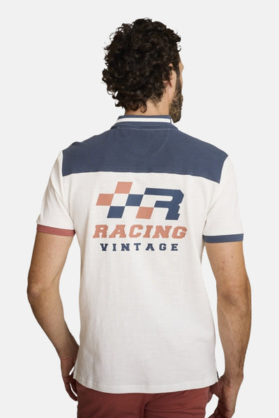 Polo à manches courtes écru de DELAHAYE, avec empiècement marine, imprimé graphique et finitions contrastées.