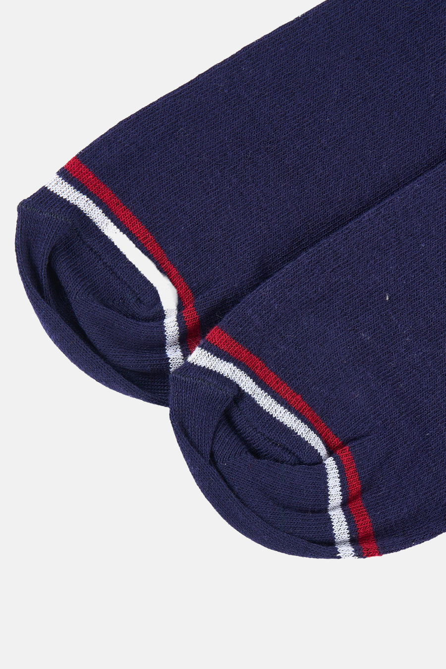 Chaussettes bleues par DELAHAYE avec rayures décoratives blanches et rouges sur le bord supérieur.