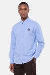 Chemise bleue à manches longues par DELAHAYE, avec logo brodé sur poitrine, boutonnée, vue de face