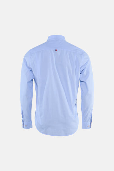 Light blue long-sleeve shirt back view with fine texture and small flag logo at collar, buttoned cuffs, clean tailored fit