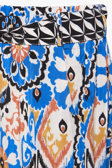 Pantalon 7/8 multicolore de More & More, avec ceinture à motif géométrique et imprimé floral.
