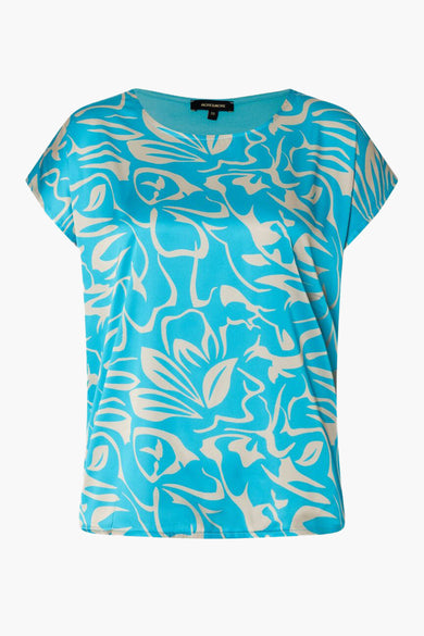 Blouse turquoise à manches courtes de MORE & MORE avec motif floral beige.
