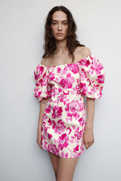 Rose floral midi robe with off-the-shoulder puff sleeves, cream base and vibrant pink blossoms, front view on model