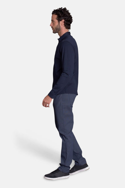 Navy blue long-sleeve chemise side view, worn with dark trousers and black sneakers, smooth fabric, slim fit