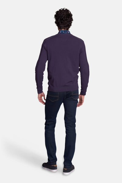 Violet O-neck sweater back view with ribbed cuffs and hem, worn with dark jeans and sneakers