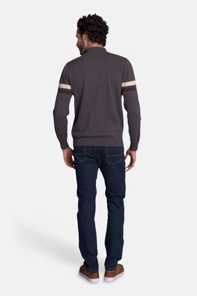 Brown knit gilet with ribbed hem and sleeve stripes, back view on model wearing dark jeans and brown sneakers
