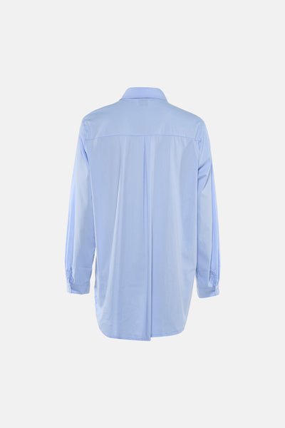 Chemise bleue à manches longues de Terra di Siena, avec pli au dos et coupe ample.