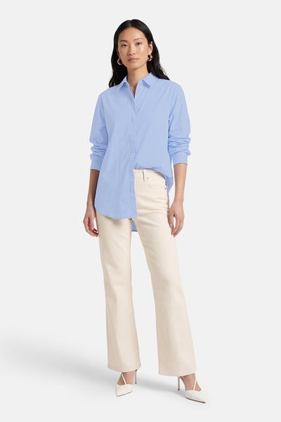 Chemise bleue à manches longues de Terra di Siena, avec coupe ample et ourlet asymétrique.
